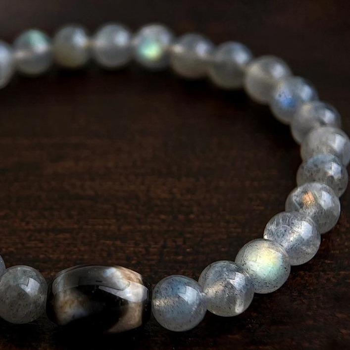 Crystals and gemstones bracelet on a dark brown background
